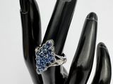 an image of a hand with a ring on it ' s finger