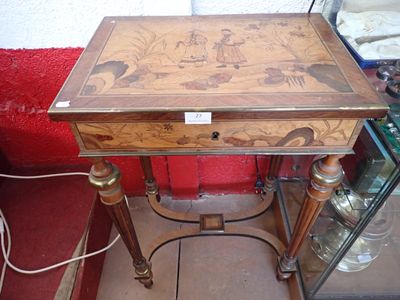 a small wooden table with a drawer on top of it