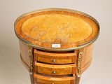 an antique wooden table with three drawers and a drawer underneath it