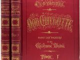 un livre rouge orné de lettres dorées, avec deux livres devant