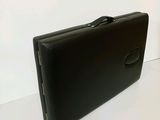 a black briefcase sitting on a white surface