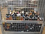 a large metal cage filled with bottles of wine
