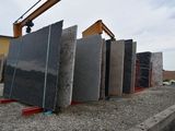 a lot of granite slabs stacked on top of each other