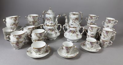a lot of cups and saucers on the table