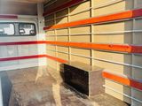 a bus that is parked in a lot with its doors open