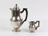 silver plated coffee pot and creamer on a white background