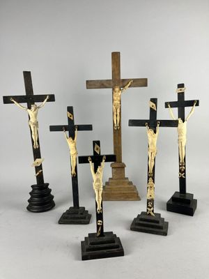 three crucifixs of jesus and a cross on a stand