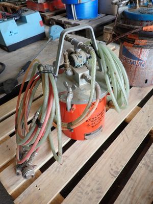 a fire hydrant sitting on a pallet in a garage