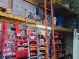 a man that is standing next to a ladder in a garage