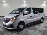 a picture of a silver van parked on a checkered floor