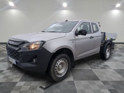 a picture of a silver pick up truck parked in a garage