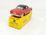 a red toy car sitting on top of a yellow box