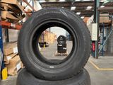 two tires stacked on top of each other in a warehouse