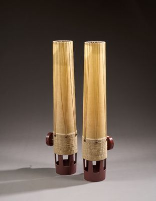 two tall vases that are made out of wood