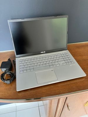 a laptop computer sitting on top of a wooden desk