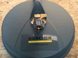 a close up of a blue vacuum cleaner on a wooden floor
