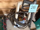 an image of a garage with a lot of tools on the floor