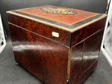 an old wooden chest with a decorative design on the top