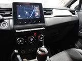 a car dashboard with a steering wheel and a tablet on the dashboard