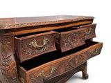 an image of a wooden chest of drawers with ornate carvings