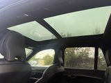 a view of the sunroof in the back of a car