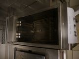 a sign on the door of a commercial oven