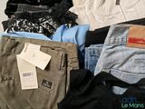 a pile of clothes that is sitting on a table