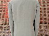the back of a light gray jacket on a mannequin mannequin mannequin mannequin mannequin mannequin mannequin manne