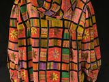 an image of a colorful jacket on a mannequin stand