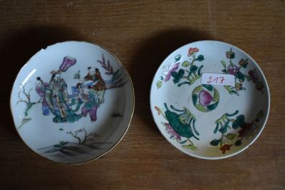 two plates that are sitting on a wooden table