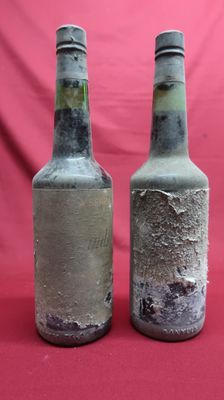 two bottles that have been left on the table