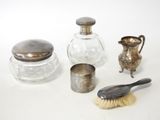 a lot of silver objects on a white surface