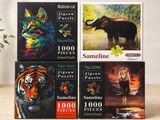 four puzzles of different animals are on a table next to a potted plant