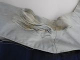 a close up of a piece of cloth with a tassel on it