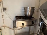 an image of a kitchen with a stove and a washing machine