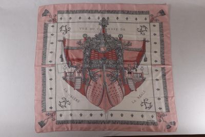 a picture of a pink scarf with a picture of two knights on it