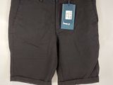 a close up of a pair of shorts hanging on a hanger