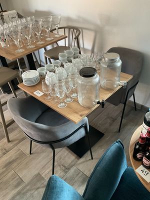 a table with a lot of empty glasses on it