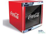 a small red coca cola cooler with the word coca written on it