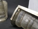 two glass lamps that are sitting on a table