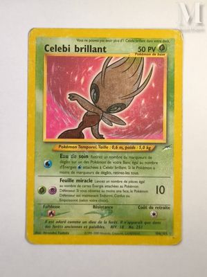a close up of a pokemon card on a white surface