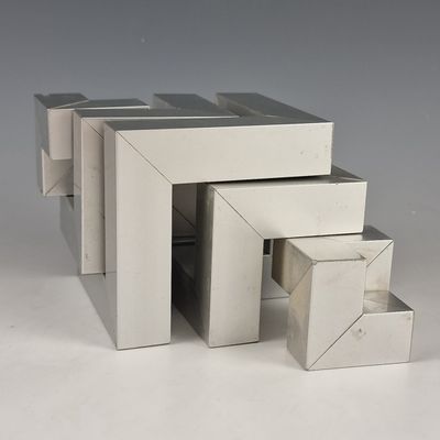 three boxes stacked on top of each other on a table