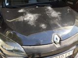 a black car that is parked in a parking lot