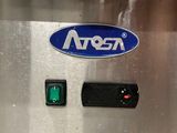 an image of a close up of a machine with a green button