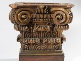 a close up of a wooden pillar with a carved design on it