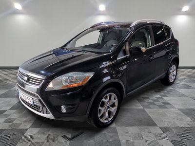 the 2013 ford escape is parked in the garage