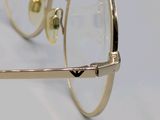 pair of glasses on a white surface with a white background