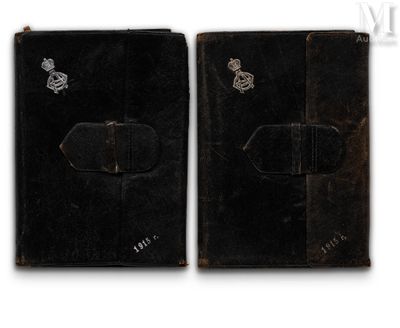 an image of a pair of black leather cases with silver emblems