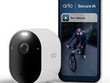 an image of a smart home security camera next to an iphone