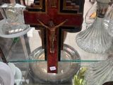 a cross on a glass table in a store